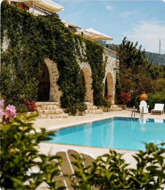 The hotel's stone-arched garden and pool