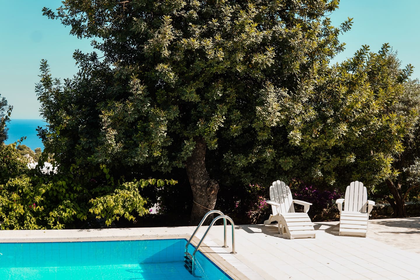 The pool terrace with a mountain view